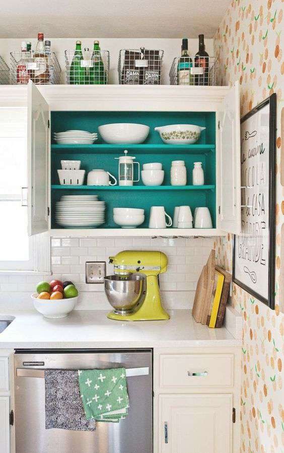 paint the back wall of your cabinets a bright color to give you a budget decor surprise when you grab a cup for coffee.